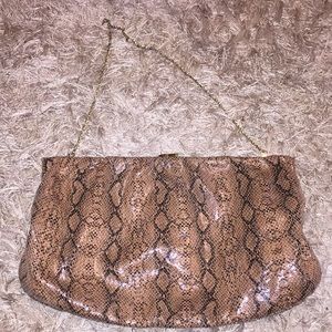 Faux snakeskin purse with chain strap.